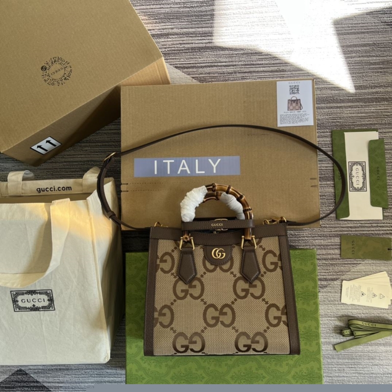 G*u*i top handle bags